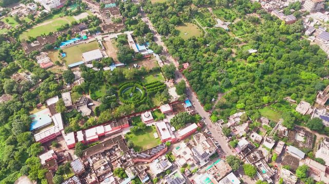 Wide drone view of Alwar city with buildings, clean streets, greenery