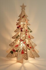 Decorative illuminated paper Christmas tree with floral patterns  