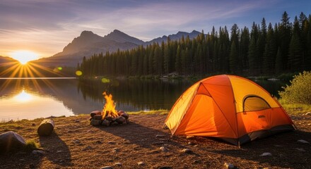 An orange tent pitched near a lake with a mountain range in the background, illuminated by a setting sun.