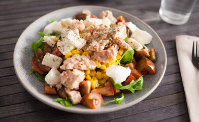 Closeup of salad with fish and vegetables for lunch