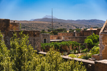 fragments of old historic buildings covered with vines