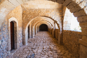 a long, empty corridor in a historic building