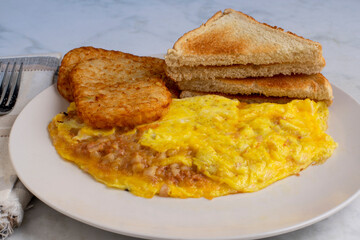 corn beef hash omelette with hash browns