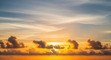 Vibrant Golden Hour Sunset Sky with Serene Cloudscape and Warm Atmospheric Hues