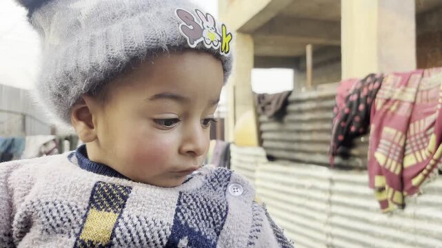 Closeup side view of Asian baby boy dancing on the music on mother's lap. Cute baby boy playing and dancing on music development of mental health and physical health.