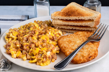 scramble eggs mixed with  corn beef hash withhash browns