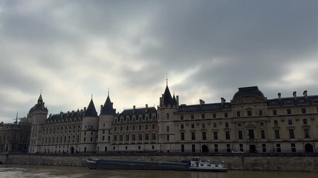 Tour de l&rsquo;Horloge at Palais de la Cit&eacute; in Paris, France, featuring its historic clock tower and Gothic architecture, ideal for travel, history, and European heritage footage.