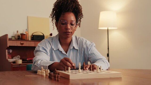 Woman Playing Chess at Home