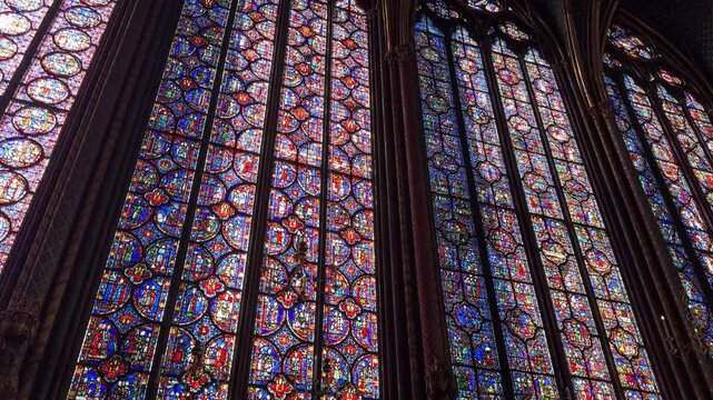 Interior details of Sainte-Chapelle in Paris, France, featuring stained glass windows and Gothic architecture, ideal for travel, history, and European heritage footage.