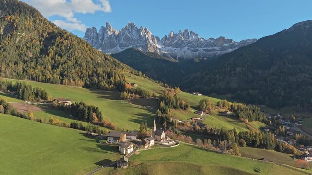 Aerial view of Santa Maddalena Church in scenic Val di Funes, Dolomites