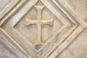 San Clemente Basilica.  Carved marble cross motif in geometric panel, early Christian decoration.