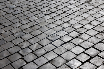 St. Peter&rsquo;s Basilica. Roman cobblestone pavement of Saint Peter&rsquo;s Square, worn basalt blocks forming rhythmic geometric pattern.