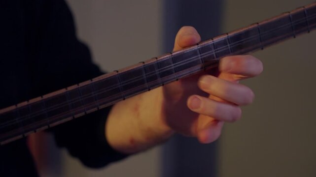 Hands Playing Baglama Saz Neck &ndash; Traditional Turkish String Instrument