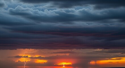 Dramatic sunset over water with dark storm clouds and a lightning strike