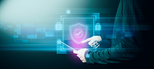 hand of businessman interactive touching a holographic anti-virus security shield system network and technology, success of innovation