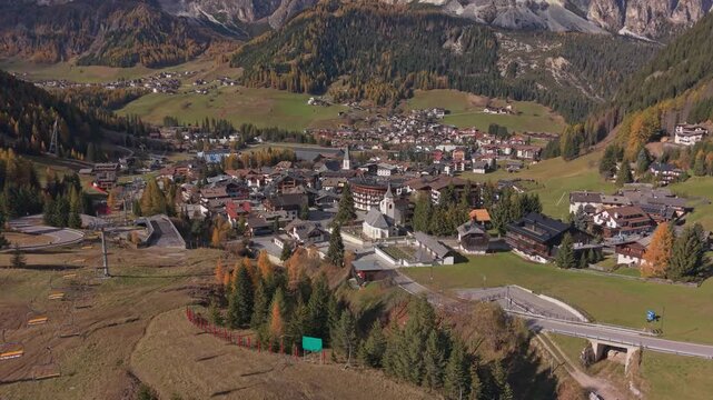 Autumn aerial view of Corvara and mountain landscape, Dolomites, Italy