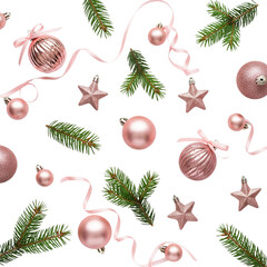 Elegant rose gold christmas ornaments and pine sprigs scattered on white
