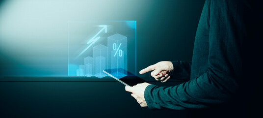 hand of businessman interactive touching a holographic financial growth graph chart system network and technology, success of trading innovation