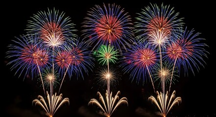 Vibrant fireworks display illuminating the night sky with colorful bursts of light