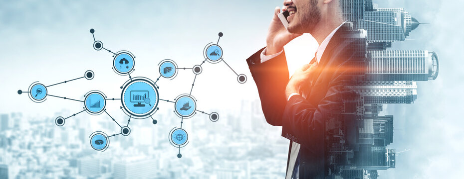 A professional businessman in a suit engages in a phone conversation while digital network icons emerge, symbolizing connectivity and modern technological innovation in an urban setting. Tessel