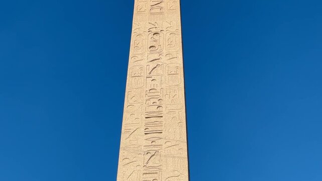 Luxor Obelisk at Place de la Concorde in Paris, France, showcasing the ancient monument and its historic Egyptian inscriptions, ideal for travel, history, and cultural footage.
