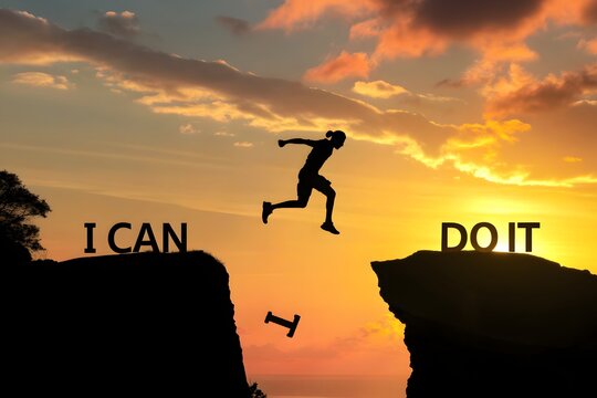 A silhouette man jumping over cliffs for "I can do it" good mindset by never give up concept