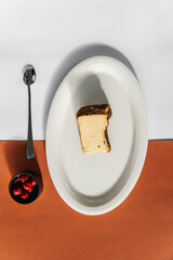 Cheesecake dessert decorated with cherry jam and whole cherries