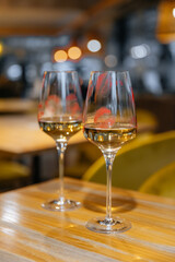 Lips with lipstick on a glass of wine in a restaurant on the table