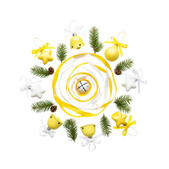 Festive yellow christmas ornaments and pine sprigs arranged in a circle