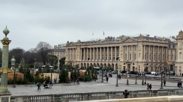 Place de la Concorde in Paris, France, featuring its fountains, obelisks, and surrounding historic buildings, ideal for travel, cityscape, and European heritage footage.