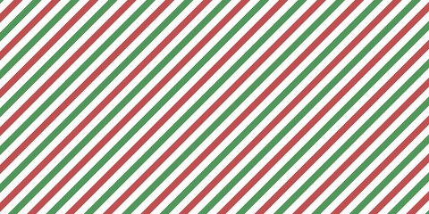 Red and green diagonal striped pattern background. Seamless Christmas stripe design for wrapping, banner, and digital projects with a bold and festive seasonal look.