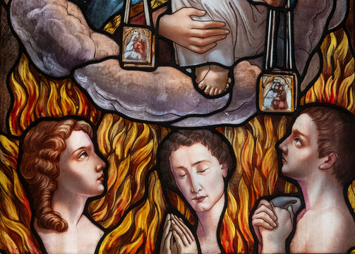Stained glass (19th century) of Mary and Jesus giving the scapular to deliver souls from purgatory.