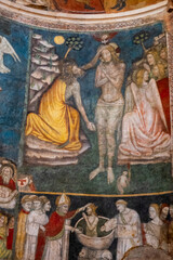 Obraz premium Fresco (14th century) of Baptism of Jesus by John the Baptist in the Jordan river.