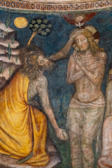 Fresco (14th century) of Baptism of Jesus by John the Baptist in the Jordan river.
