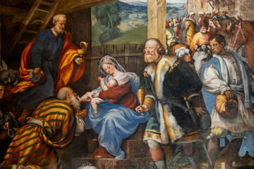 Obraz premium Painting (19th century) of Christmas Nativity Scene : Adoration of the Magi as they present gifts of gold, frankincense and myrrh to the Infant Jesus.