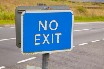 Blue Non-Exit Sign Indicating No Exit Route on Public Rural Road