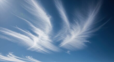 Cirrus cloudscape against a vibrant blue sky on a bright day creating a serene airy atmosphere