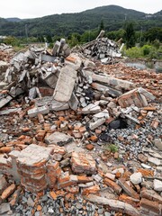Structure building destruction rubble waste debris heap pile aerial view