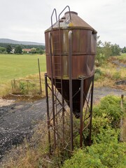 Old rusty water tower watertower on farm