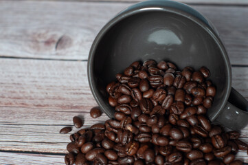 Cup cup with scattered coffee beans.