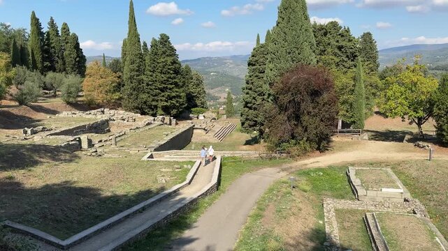 Ancient Roman and Etruscan ruins in Fiesole near Florence, showing stone walls, archaeological remains, and scenic surroundings ideal for history, travel, and cultural footage.