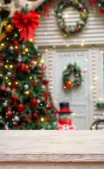Festive Christmas Ambiance: Capture the festive spirit of Christmas, a beautifully decorated Christmas tree, a warm doorway adorned with festive wreaths.