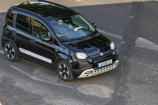 Fiat panda cross driving on asphalt road during day
