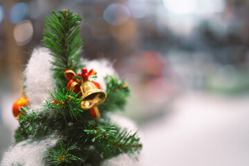 Closeup garland Christmas tree decoration,red,gold,silver ornament with bokeh background. Perfect holiday sales, winter celebration, festive seasonal promotions, marketing, shopping with copy space