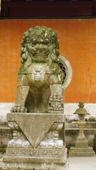 The stone carved lion located in the front of the old temple of china
