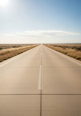 Endless asphalt road disappearing into the horizon under a serene sky