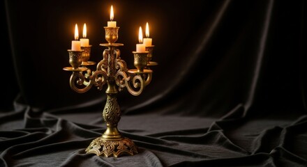 Golden candelabra with glowing candles creates a romantic ambiance and timeless elegance, perfect for celebrations