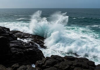 Dynamic view of powerful ocean waves surging and crashing against dark, rugged coastal rock formations, creating dramatic white sea foam and natural water spray ,marine ,seascape ,crashing