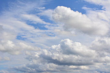 Bright Blue Sky with Fluffy White and Grey Cumulus Clouds