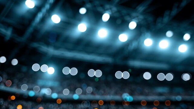 Stadium lights defocused. Professional soccer stadium at night. Blurred lights